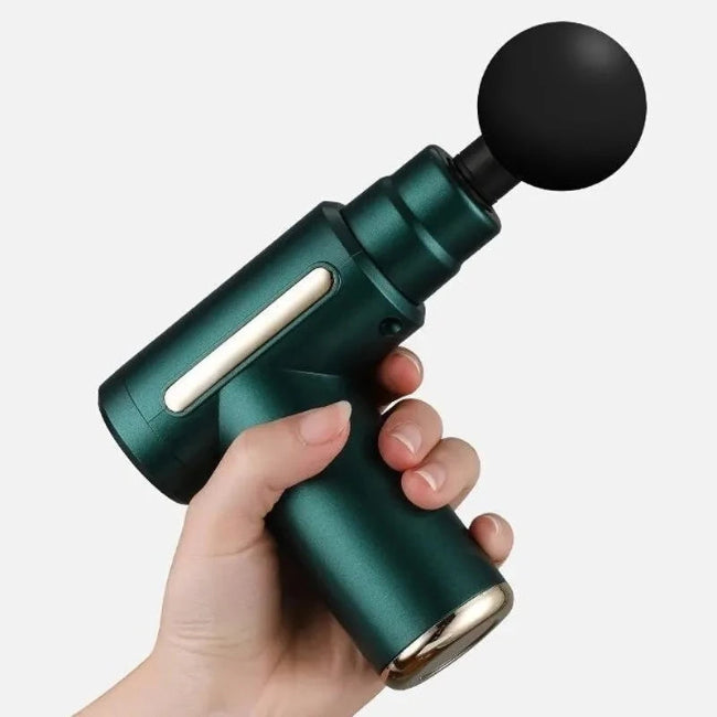 A hand holding a green massage gun with a black spherical attachment.